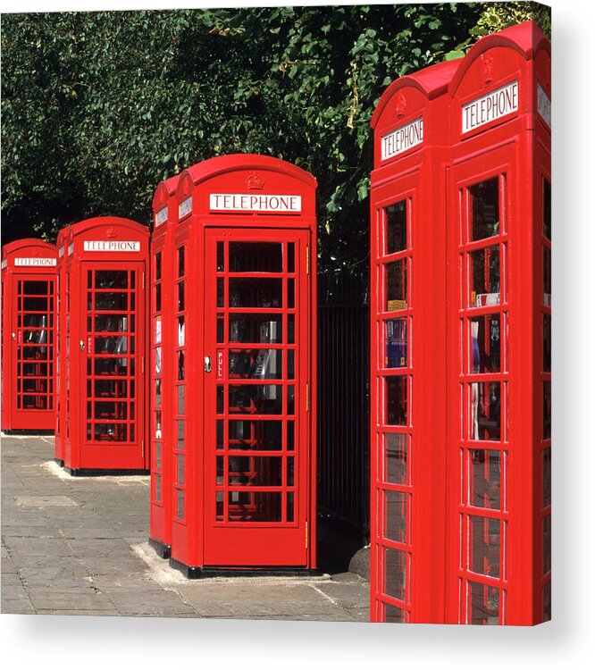 In A Row Acrylic Print featuring the photograph Traditional Red Telephone Boxes In by Hisham Ibrahim