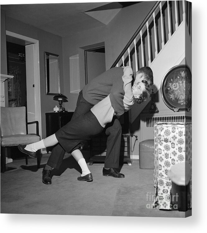 1950s Acrylic Print featuring the photograph Teen Couple Dancing In Living Room by H. Armstrong Roberts/ClassicStock