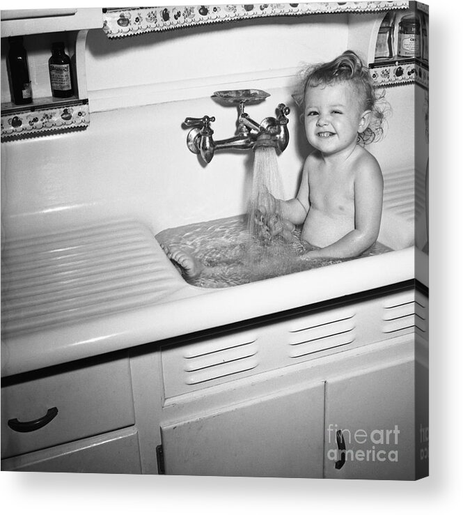 Toddler Acrylic Print featuring the photograph Little Girl Taking Bath In Kichen Sink by Bettmann