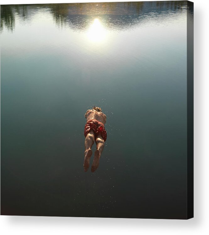 Diving Into Water Acrylic Print featuring the photograph Mature Man Diving Into Lake, Rear View by Ascent/pks Media Inc.
