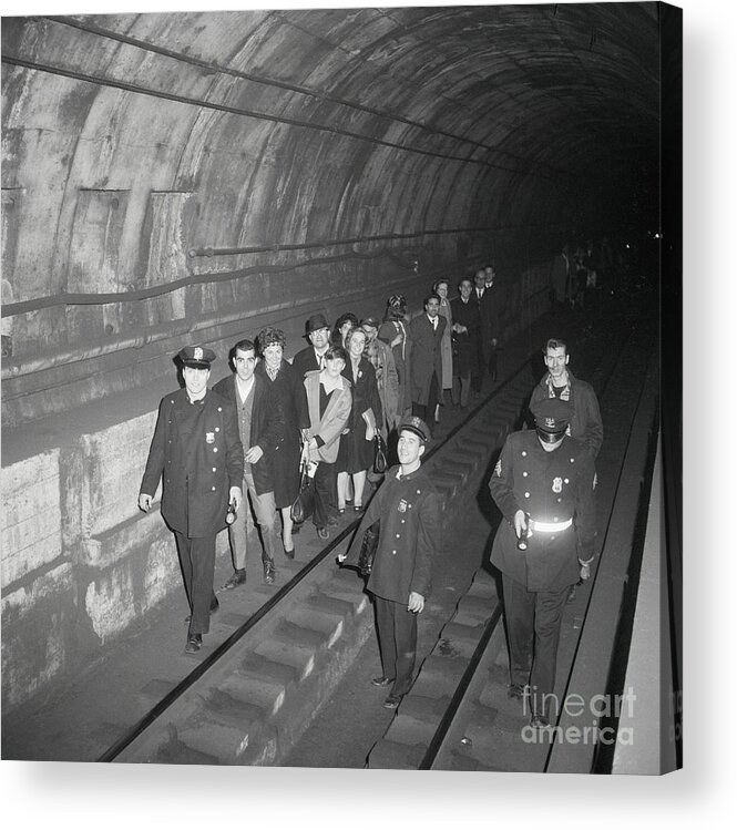 People Acrylic Print featuring the photograph Passengers Being Lead Through Subway by Bettmann
