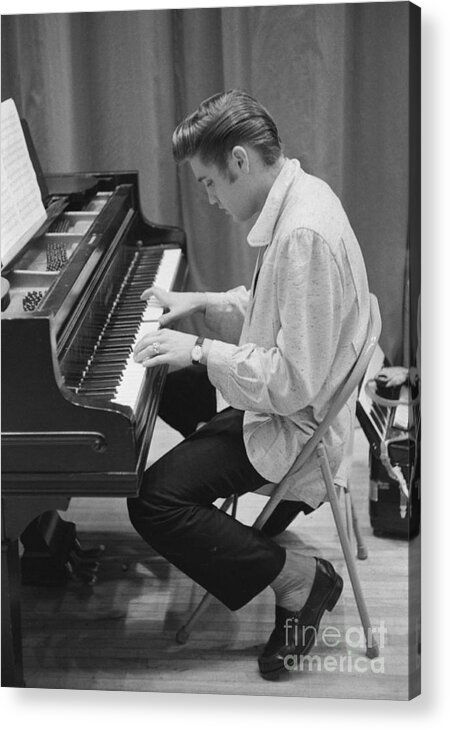 Elvis Presley Acrylic Print featuring the photograph Elvis Presley on piano while waiting for a show to start 1956 by The Harrington Collection