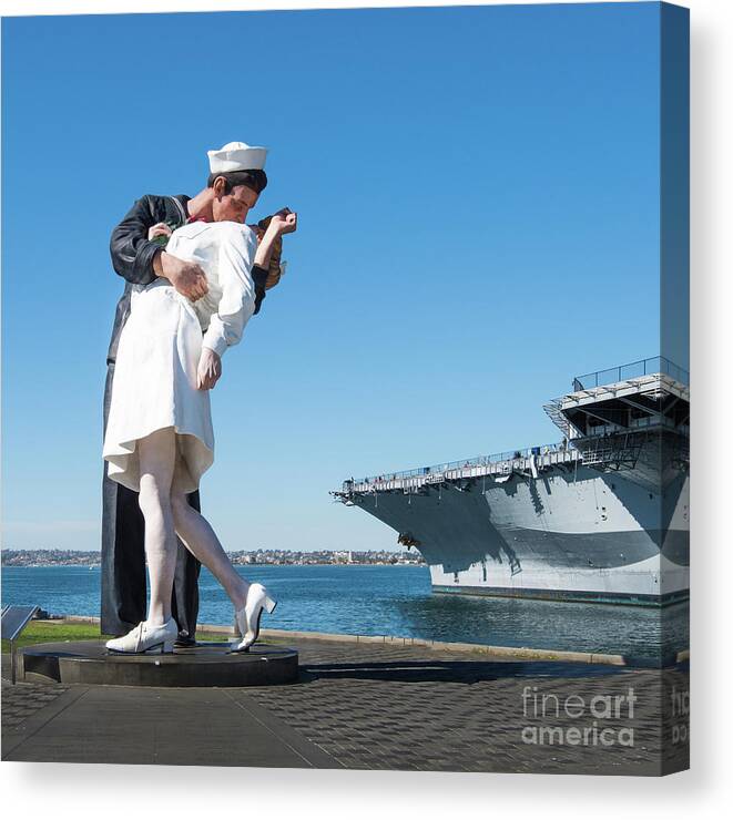 Embracing Peace Sculpture Canvas Print featuring the photograph Embracing Peace Sculpture and USS Midway Aircraft Carrier by David Levin