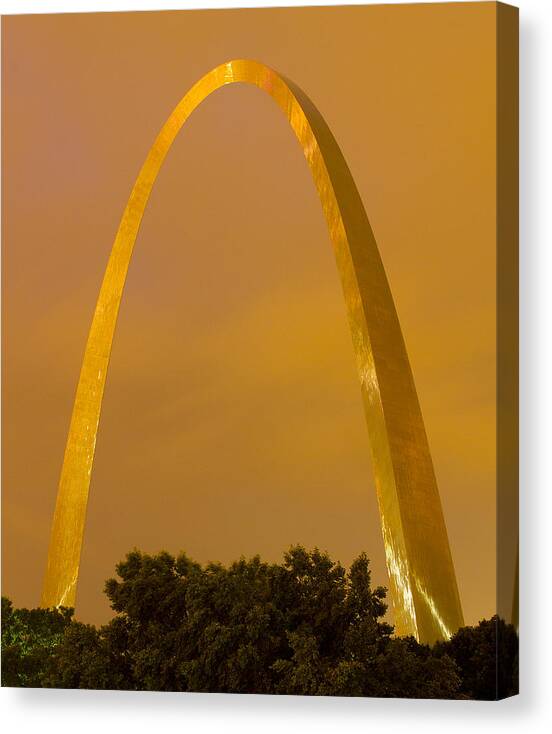 St Louis Canvas Print featuring the photograph The Arch in the glow of St Louis city lights at night by Garry McMichael
