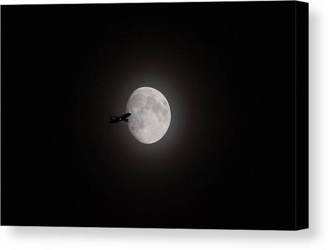 Moon Canvas Print featuring the digital art Airliner passing in front of the Moon #1 by Gary Eason