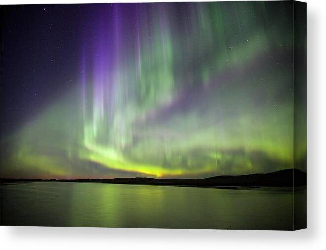 Aurora Borealis Canvas Print featuring the photograph Aurora Borealis Over Water #1 by Roger Hill
