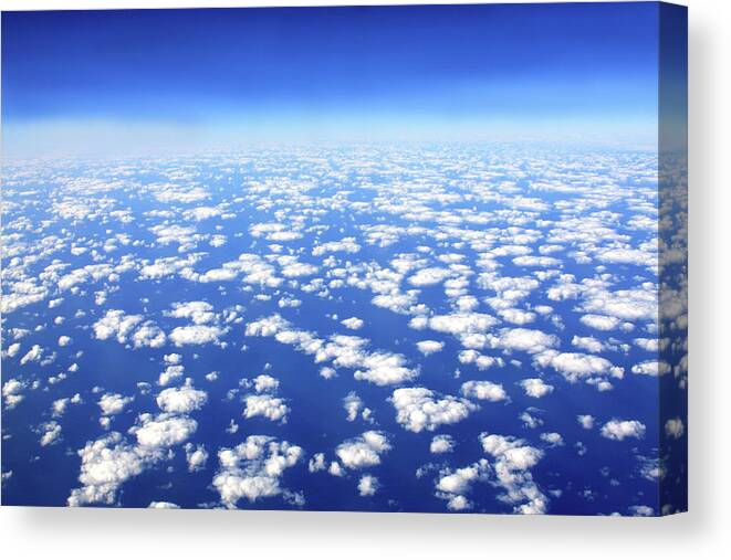 Flying Canvas Print featuring the photograph Above The Clouds by James Knight