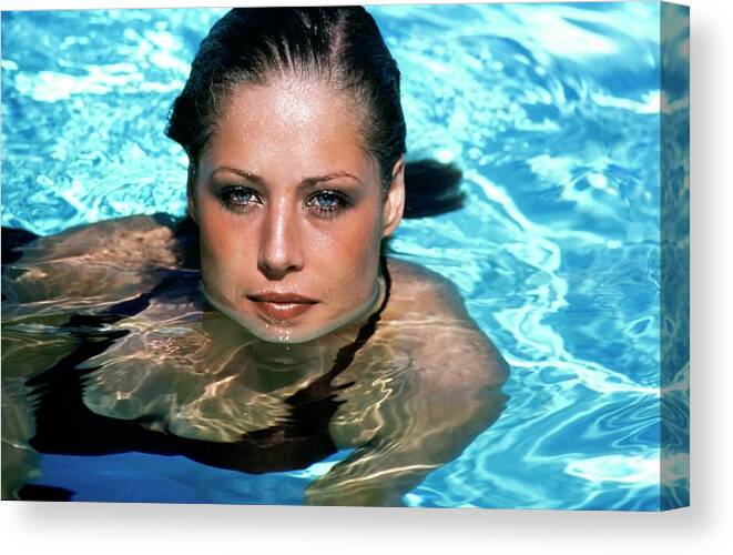 Swimwear Canvas Print featuring the photograph Model In A Swimming Pool by Arthur Elgort