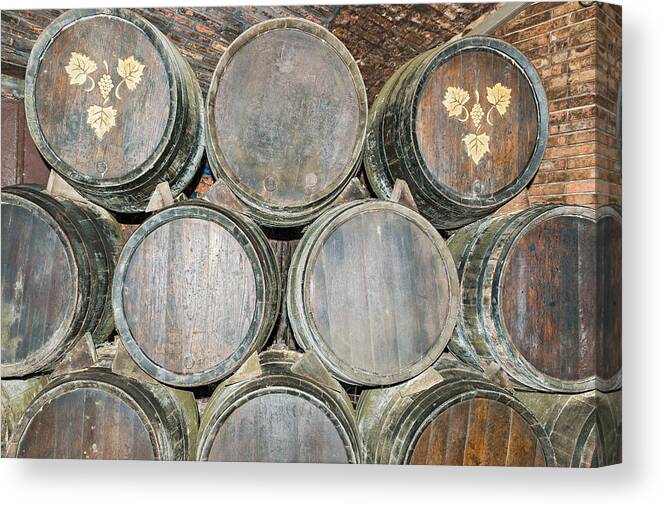 Barrel Canvas Print featuring the photograph Old wine barrels in Codorniu winery in Spain #1 by Marek Poplawski