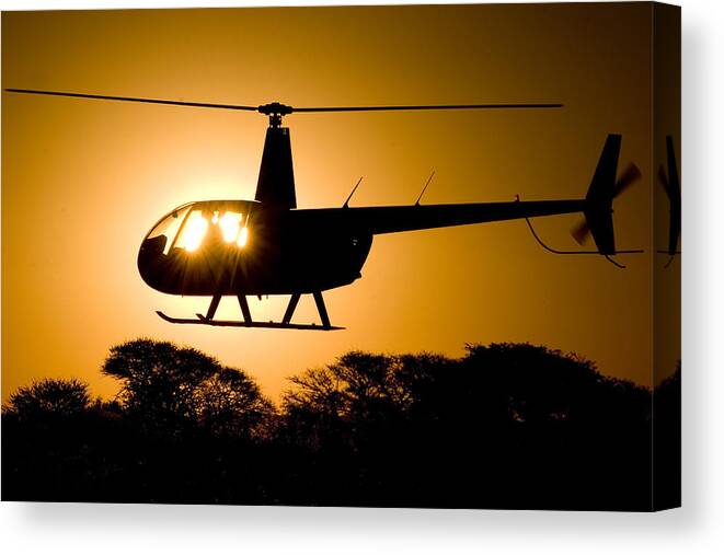 Helicopter Canvas Print featuring the photograph R44 Sunset #1 by Paul Job