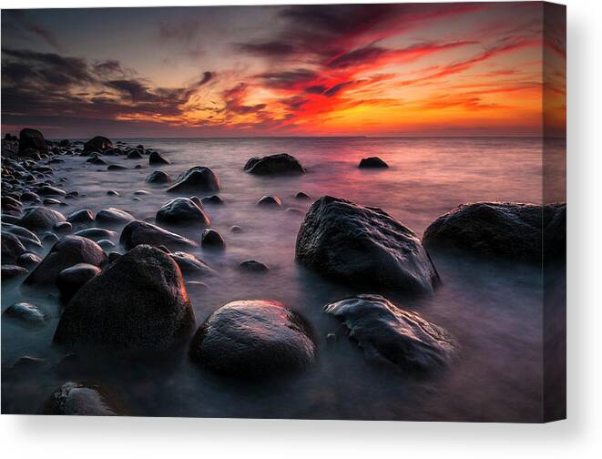 Baltic Sea Canvas Print featuring the photograph Rocks On A Beach At Sunset By The Sea #1 by Andreas Jakel