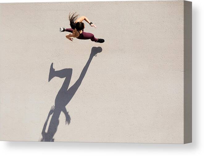 Shadow Canvas Print featuring the photograph Sprinter seen from above with shadow and copy space. #1 by Tempura