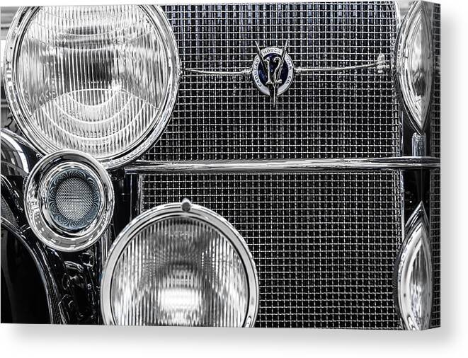 1935 Canvas Print featuring the photograph 1935 Cadillac V12 Roadster Emblem and Headlights 1 by Ron Pate