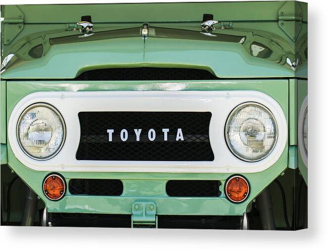 1969 Toyota Fj-40 Land Cruiser Grille Emblem Canvas Print featuring the photograph 1969 Toyota FJ-40 Land Cruiser Grille Emblem -0444c by Jill Reger