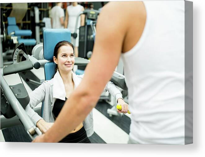 Two People Canvas Print featuring the photograph Woman Exercising With Trainer #2 by Science Photo Library