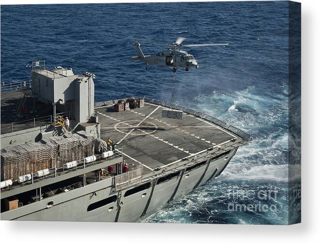Uss Nimitz Canvas Print featuring the photograph An Mh-60s Sea Hawk Conducts A Vertical #3 by Stocktrek Images