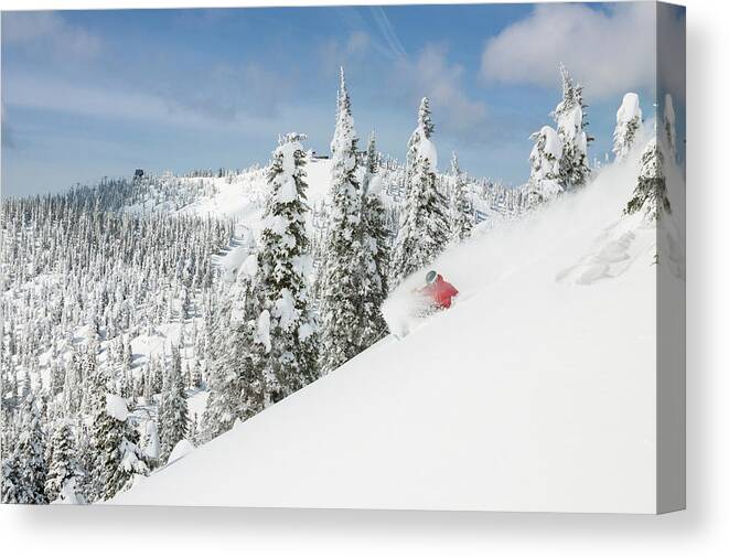 Frozen Canvas Print featuring the photograph Male Skier Makes A Deep Powder Turn #4 by Craig Moore