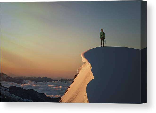 People Canvas Print featuring the photograph A Female Climber On A Snowy Mountaintop by Buena Vista Images