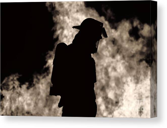 Firefighter Canvas Print featuring the photograph A Firefighter by Jim Lepard