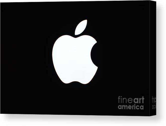 Computer Laptop Apple Macbook Pro Glowing Apple Canvas Print featuring the photograph A Glowing Apple by Robert Loe