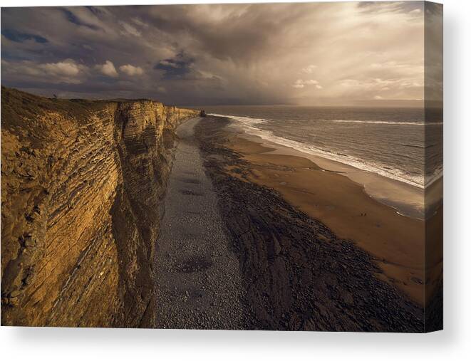 Porthcawl Canvas Print featuring the photograph A Walk by Milos Lach