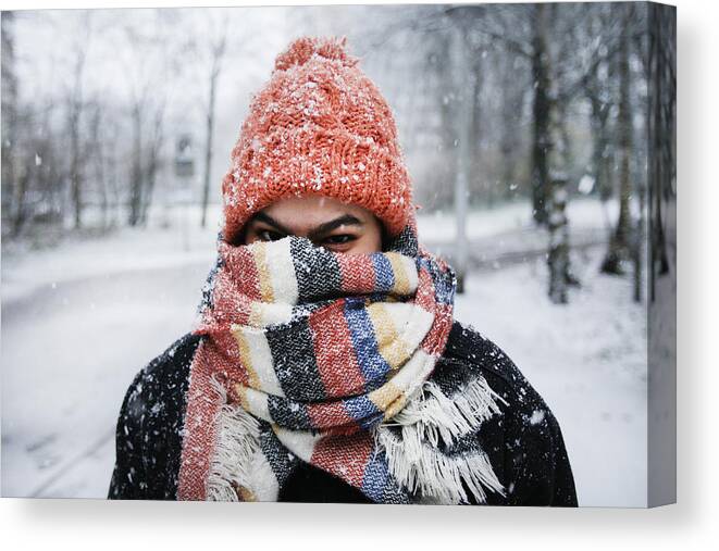 Tranquility Canvas Print featuring the photograph A young woman enjoying snowfall in Amsterdam by Paulo Amorim