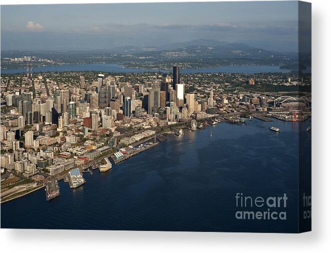 Elliott Bay Canvas Print featuring the photograph Aerial view of Seattle skyline with Elliott Bay and ferry boat by Jim Corwin
