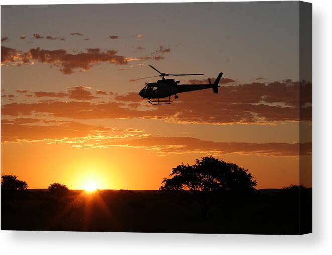 Eurocopter As350 B3 Canvas Print featuring the photograph African Sunset II by Paul Job