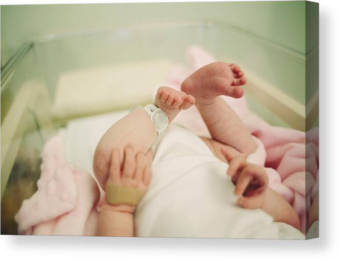 People Canvas Print featuring the photograph Baby in hospital by Sally Anscombe