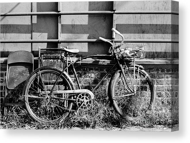 Bicycle Canvas Print featuring the photograph Bicycle with Two Chairs and Railing by Tom Brickhouse