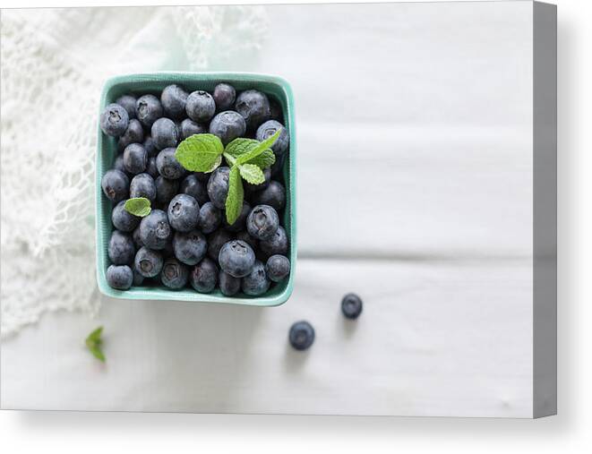 White Background Canvas Print featuring the photograph Blueberries In Bowl by Ingwervanille