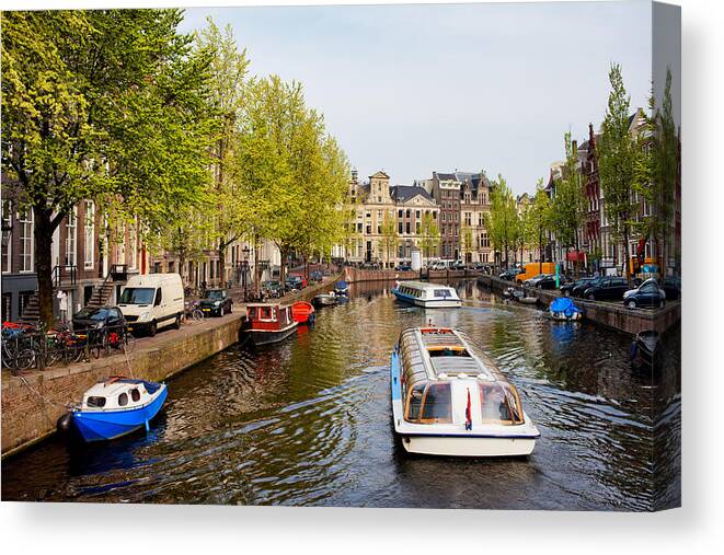 Amsterdam Canvas Print featuring the photograph Boats on Canal Tour in Amsterdam by Artur Bogacki