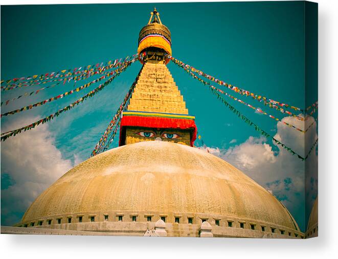 Wisdom Canvas Print featuring the photograph Boudhanath Stupa in Nepal with blue sky by Raimond Klavins