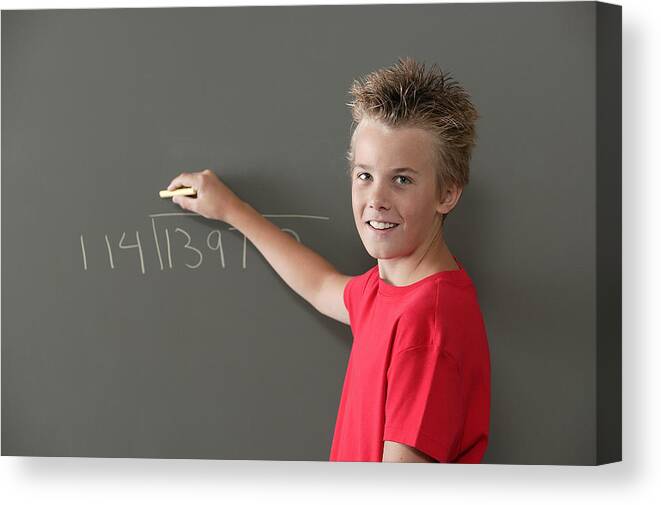 Education Canvas Print featuring the photograph Boy writing on blackboard by Comstock Images