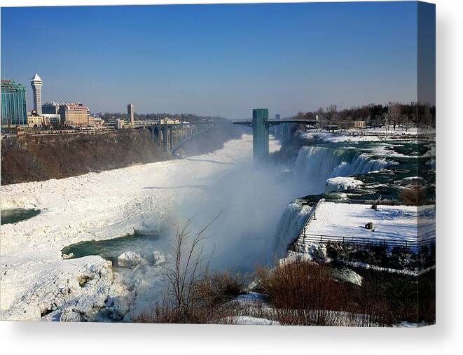 Niagara Falls Canvas Print featuring the photograph Canada and America at Niagara Falls by Eric Swan