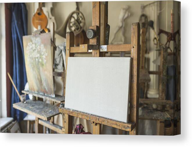 Art Canvas Print featuring the photograph Canvas on easel in art studio by Vladimir Godnik