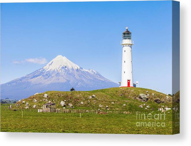 Cape Egmont Canvas Print featuring the photograph Cape Egmont Lighthouse and Taranaki by Colin and Linda McKie