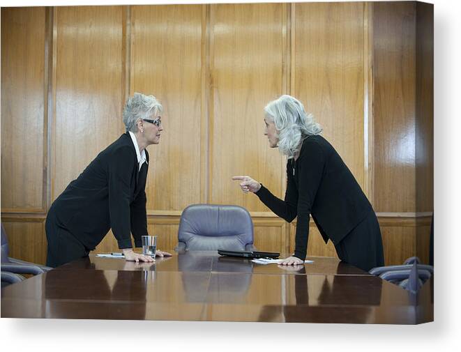 Working Canvas Print featuring the photograph Caucasian businesswoman arguing in conference room by Jacobs Stock Photography Ltd