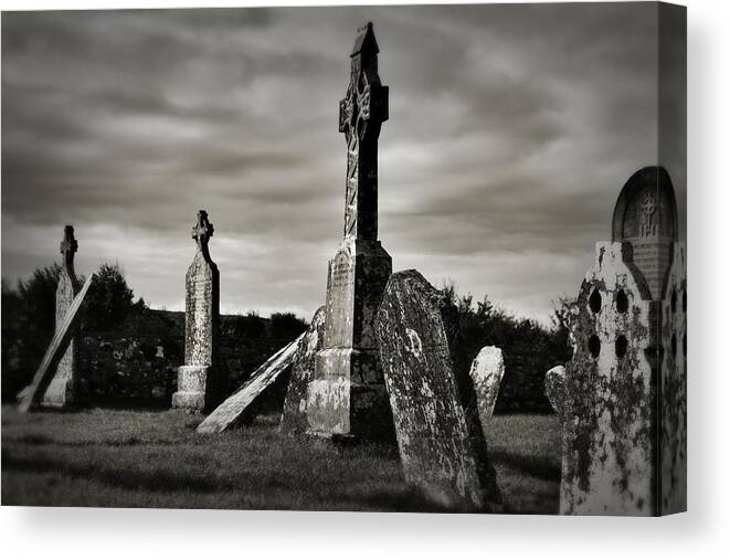 Religious Sites Canvas Print featuring the photograph Celtic Graveyard Clonmacnoise by Nadalyn Larsen
