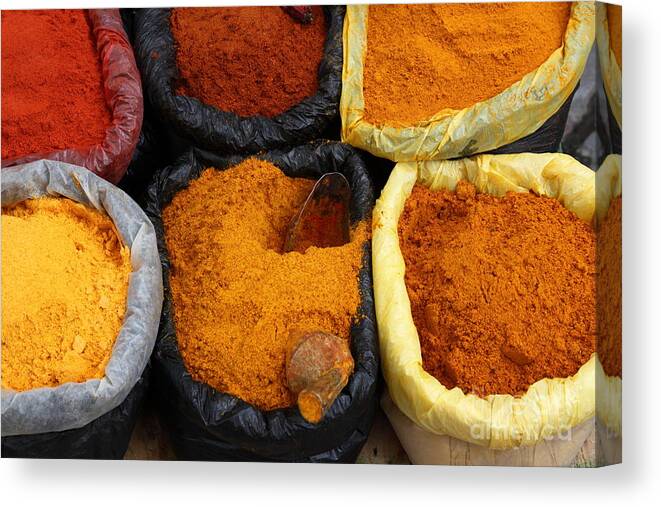 Spices Canvas Print featuring the photograph Chilli powders 1 by James Brunker