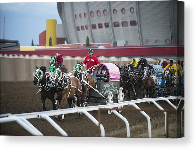 2014 Canvas Print featuring the photograph Chuckwagons Down the Stretch by Bill Cubitt