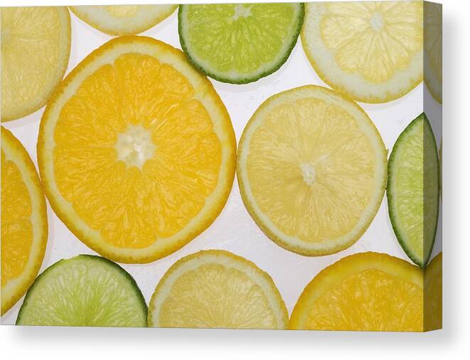 Citrus Canvas Print featuring the photograph Citrus Slices by Kelly Redinger