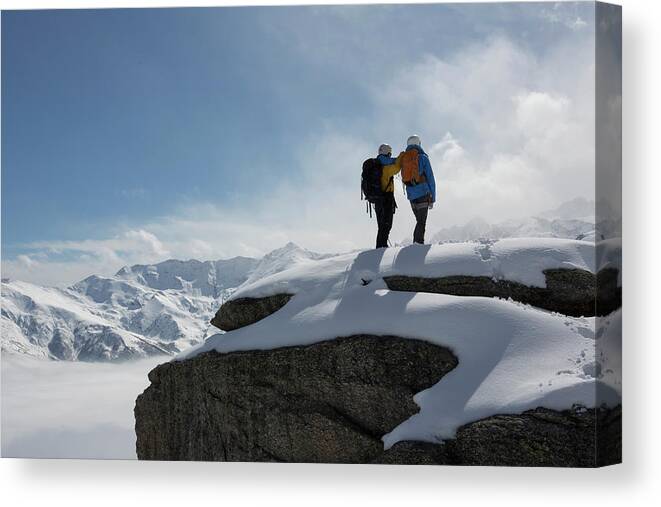 Expertise Canvas Print featuring the photograph Climbers Stand On Snowy Mountain by Ascent Xmedia