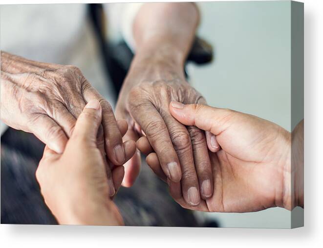 Mental Health Canvas Print featuring the photograph Close up hands of helping hands elderly home care. Mother and daughter. Mental health and elderly care concept by Ipopba