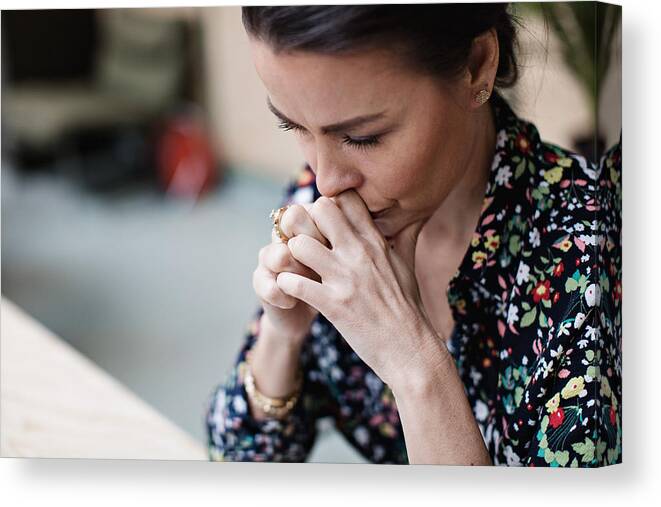 New Business Canvas Print featuring the photograph Close-up of tired thoughtful businesswoman with arms crossed at office by Maskot