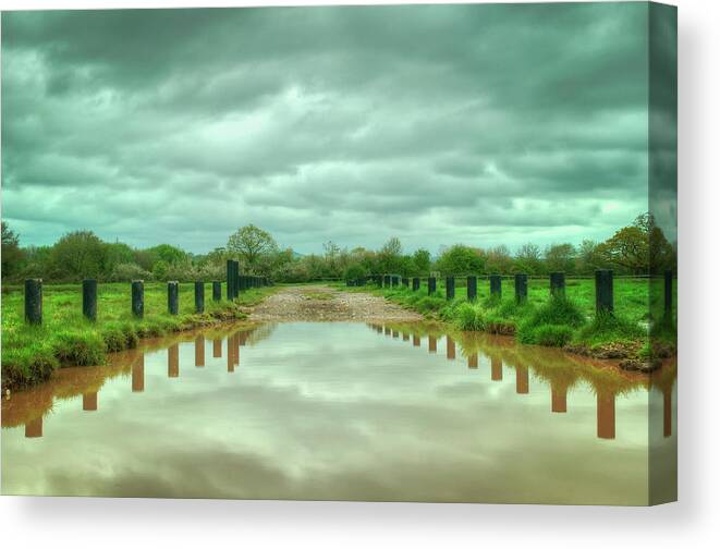 Scenics Canvas Print featuring the photograph Clouds Reflected In Flood Water by Image By Debbie Margetts - Ancora Imparo