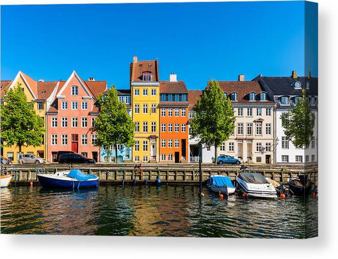 Copenhagen Canvas Print featuring the photograph Colourful houses along canal in Copenhagen Denmark by © Allard Schager