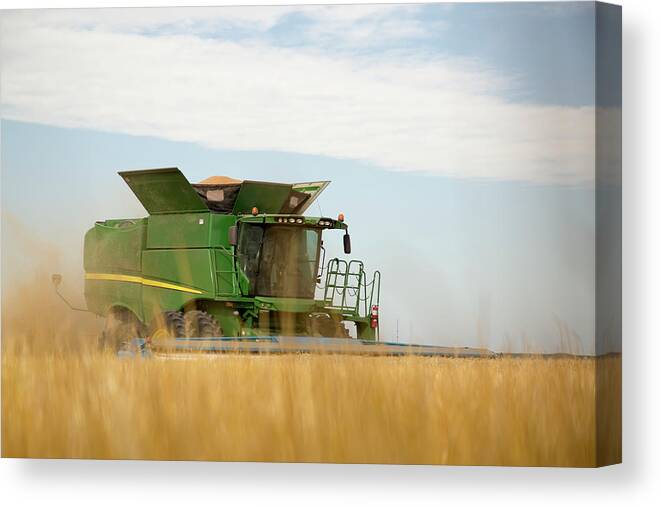 Combine Canvas Print featuring the photograph Combine Cuts Wheat In Northeast by Kevan Dee