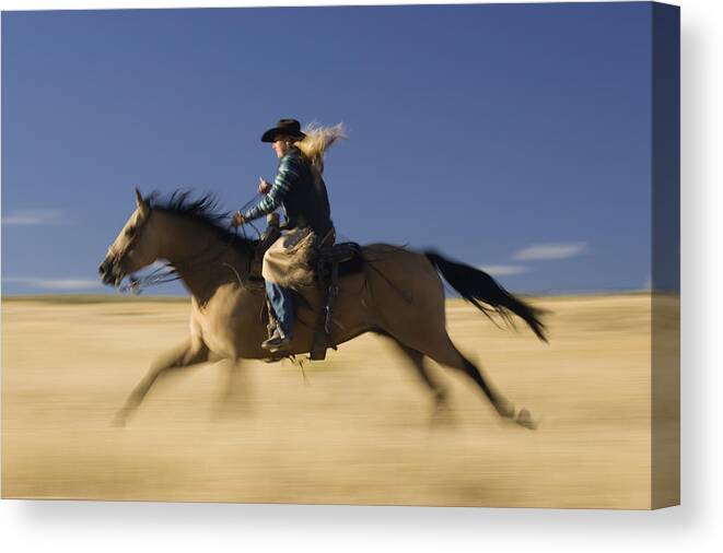 Feb0514 Canvas Print featuring the photograph Cowgirl Riding Through Field Oregon by Konrad Wothe