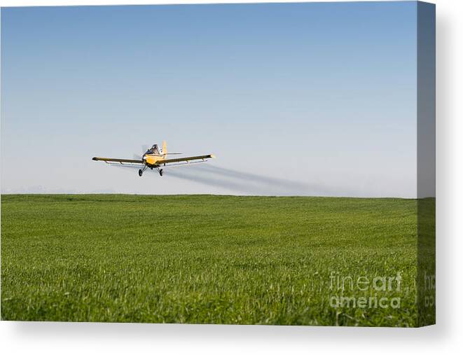 Plane Canvas Print featuring the photograph Crop Duster Airplane Flying Over Farmland by Cindy Singleton